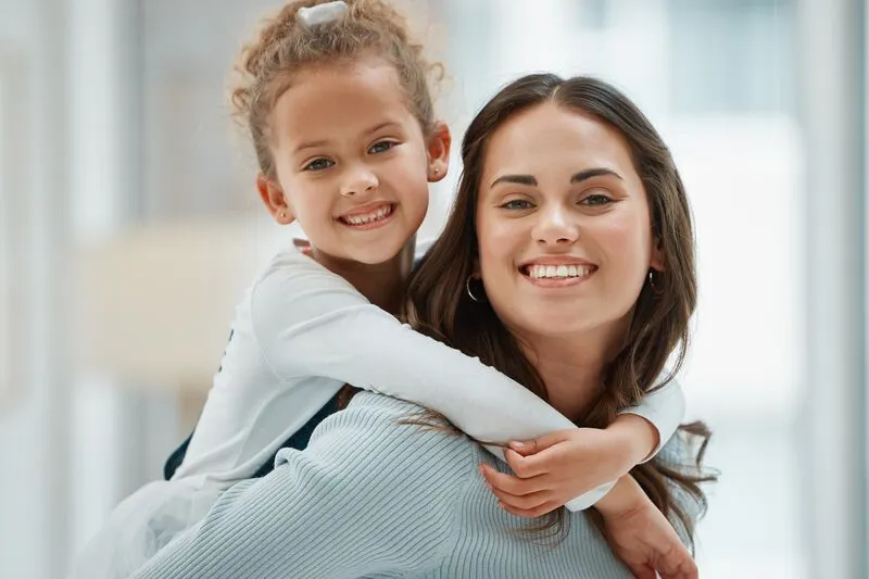 Babysitter giving a piggyback