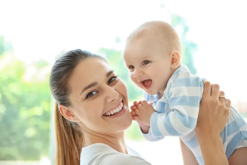Babysitter with happy baby