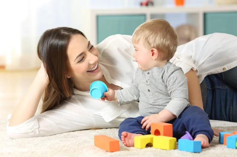 Nanny playing with baby